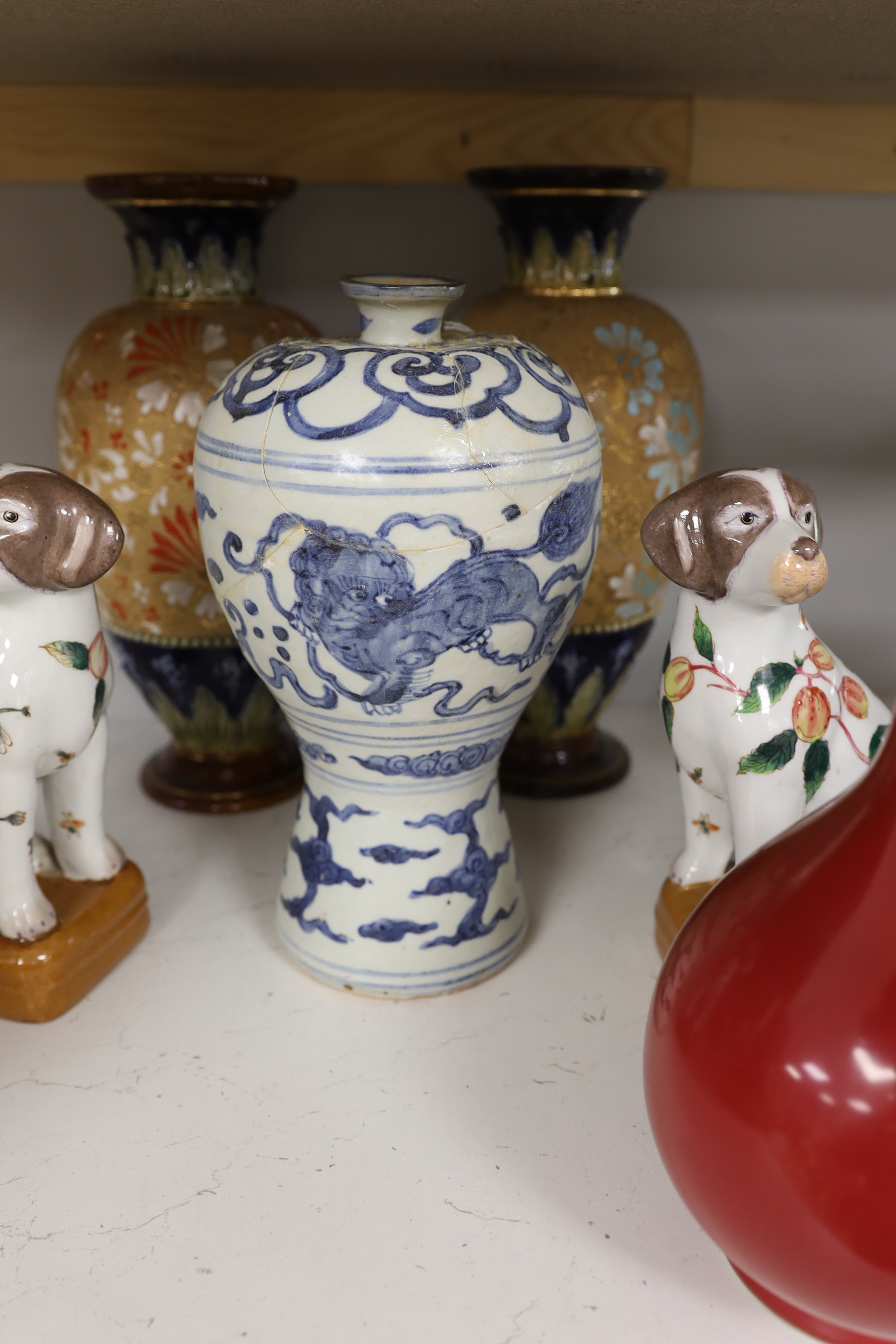 A Chinese blue and white Meiping, a copper red glaze vase and a pair of dog figures, tallest 30cm